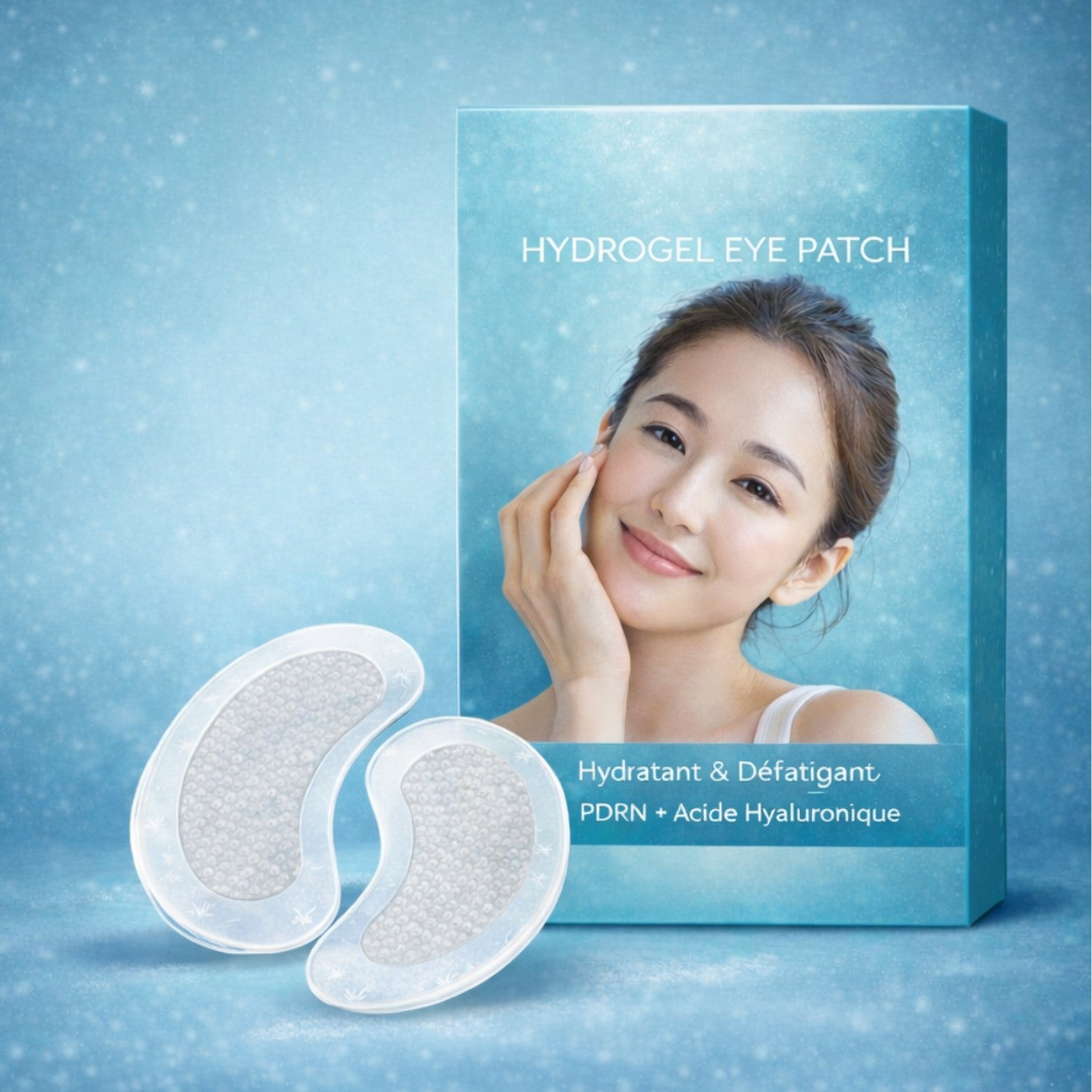 Patchs yeux à micro infusion posés sur une surface en marbre avec sachet aluminium premium, conçus pour hydrater et lisser le contour des yeux.